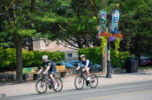 Two bicycles riding through Clarkson area